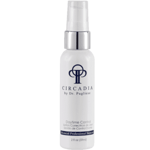 A bottle of cricadia anti - aging serum on a white background.